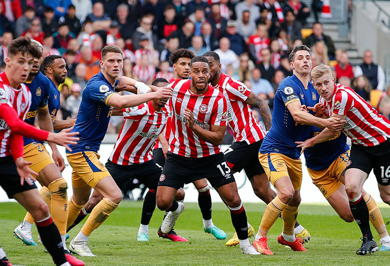 Brentford footballers Rico Henry Ben Mee Aaron Hickey battle Newcastle’s Callum Wilson Fabian Schar Sven Botman Joelinton